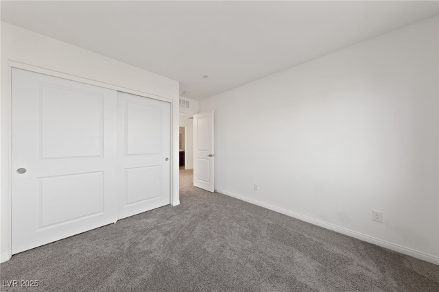 595 Beverly Pine Pl, Henderson, NV 89011 - unfurnished bedroom with baseboards, carpet, and a closet