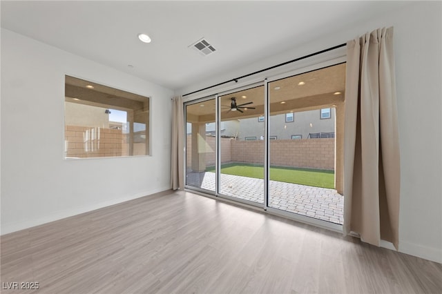 595 Beverly Pine Pl, Henderson, NV 89011 - unfurnished room with ceiling fan, recessed lighting, baseboards, wood finished floors, and visible vents