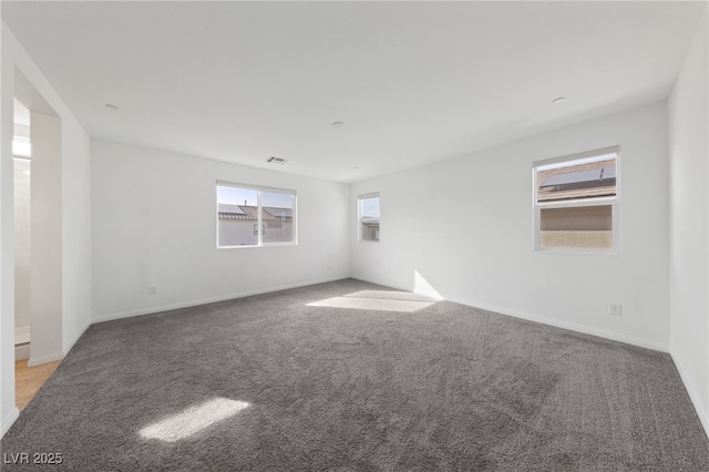 595 Beverly Pine Pl, Henderson, NV 89011 - empty room featuring baseboards, visible vents, and light carpet
