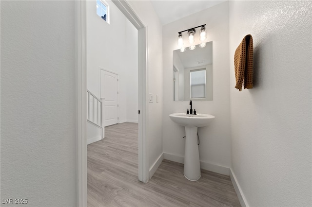 595 Beverly Pine Pl, Henderson, NV 89011 - bathroom featuring baseboards and wood finished floors