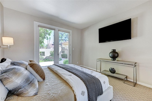 carpeted bedroom featuring access to outside and baseboards