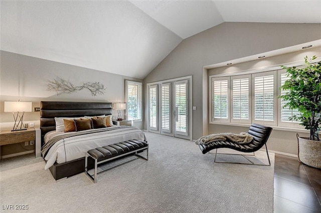 bedroom featuring baseboards, access to outside, and vaulted ceiling