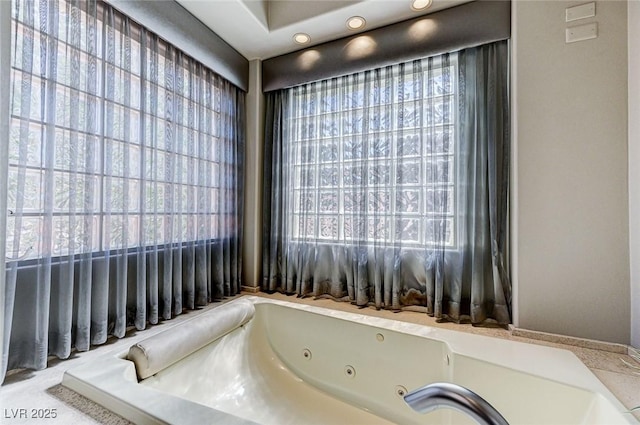 full bathroom featuring a whirlpool tub