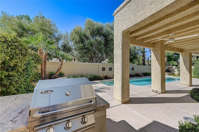 view of patio featuring a fenced in pool, a ceiling fan, a fenced backyard, and a grill