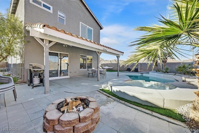 3738 Falcon Springs Dr, Las Vegas, NV 89147 - back of property featuring a fenced in pool, stucco siding, a fire pit, and a fenced backyard