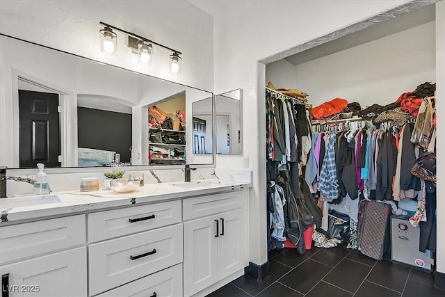 3738 Falcon Springs Dr, Las Vegas, NV 89147 - full bath with double vanity, tile patterned floors, a sink, and a walk in closet