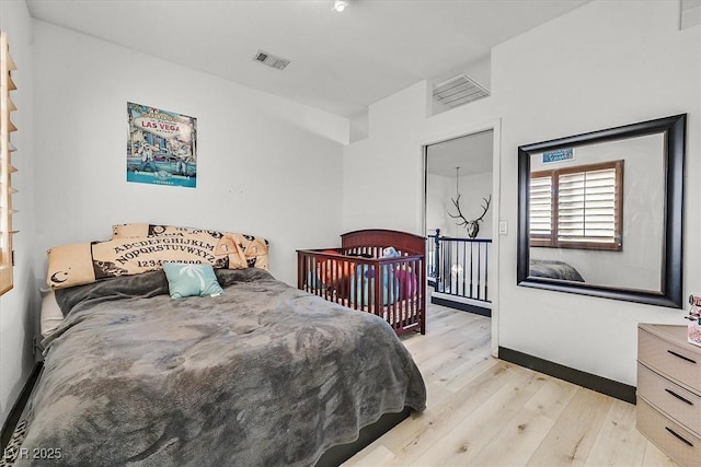 3738 Falcon Springs Dr, Las Vegas, NV 89147 - bedroom with light wood-type flooring, baseboards, and visible vents