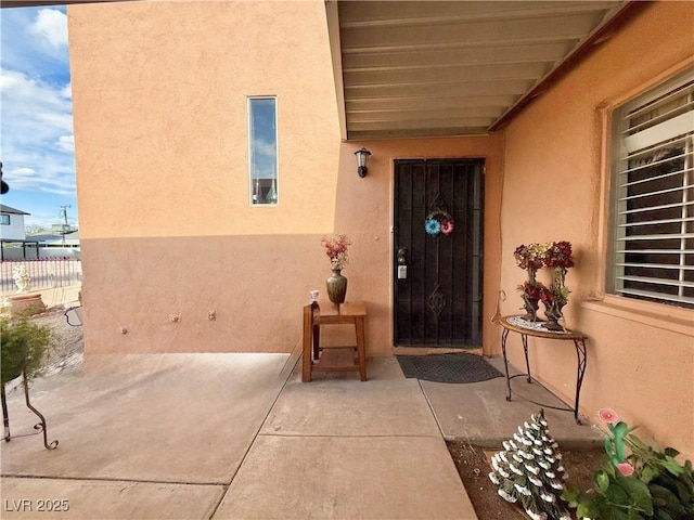 107 Elm St, Henderson, NV 89015 - entrance to property with fence, a patio area, and stucco siding