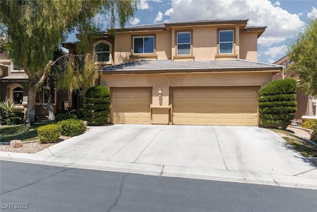 7736 Villa Andrade Ave, Las Vegas, NV 89131 - view of front of property with a garage, concrete driveway, stucco siding, and a tile roof