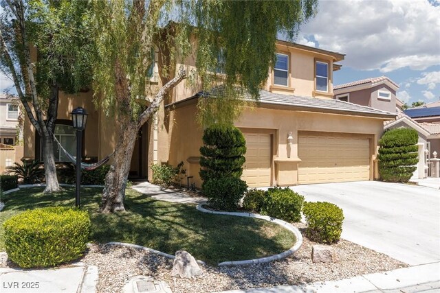 7736 Villa Andrade Ave, Las Vegas, NV 89131 - view of front facade featuring an attached garage, stucco siding, and concrete driveway