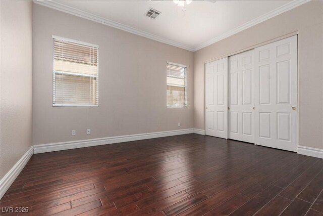 7736 Villa Andrade Ave, Las Vegas, NV 89131 - unfurnished bedroom with baseboards, crown molding, dark wood finished floors, and a closet