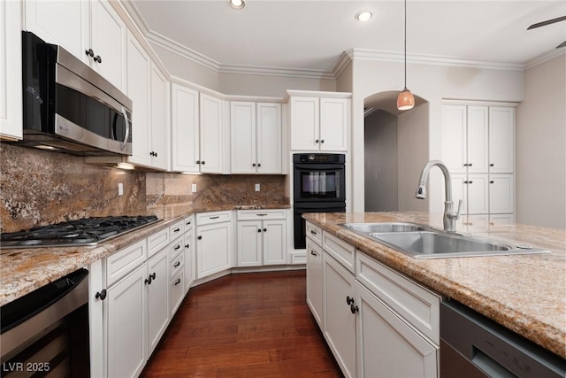 7736 Villa Andrade Ave, Las Vegas, NV 89131 - kitchen featuring appliances with stainless steel finishes, a sink, beverage cooler, ornamental molding, and white cabinetry