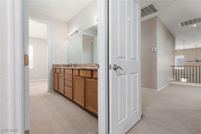 7736 Villa Andrade Ave, Las Vegas, NV 89131 - bathroom with baseboards, plenty of natural light, and vanity