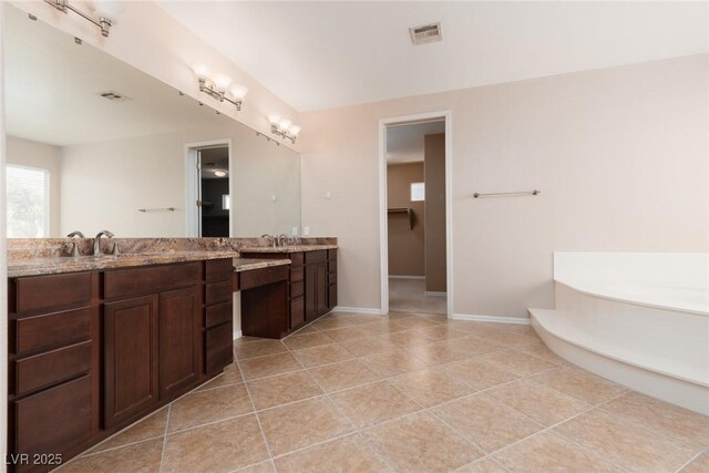 7736 Villa Andrade Ave, Las Vegas, NV 89131 - bathroom featuring tile patterned floors, vanity, a bath, and baseboards