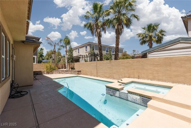7736 Villa Andrade Ave, Las Vegas, NV 89131 - view of swimming pool featuring a fenced backyard, a patio, and a pool with connected hot tub