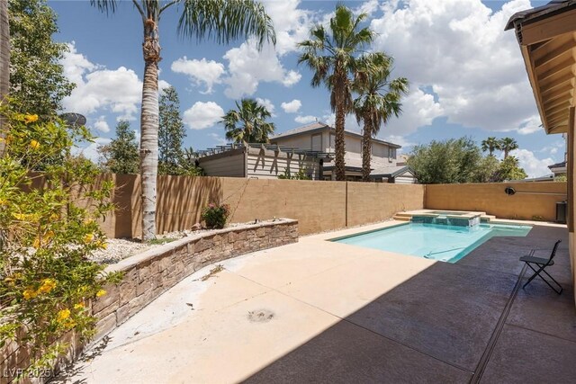 7736 Villa Andrade Ave, Las Vegas, NV 89131 - view of swimming pool with a patio, a fenced backyard, and a pool with connected hot tub