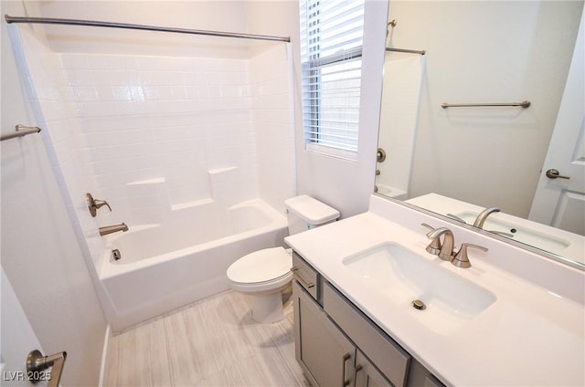 bathroom featuring vanity, bathing tub / shower combination, and toilet