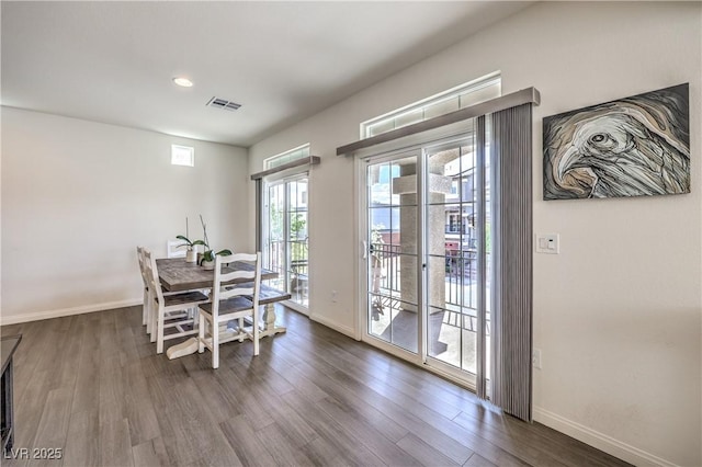 dining room featuring recessed lighting, baseboards, dark wood-style flooring, and visible vents