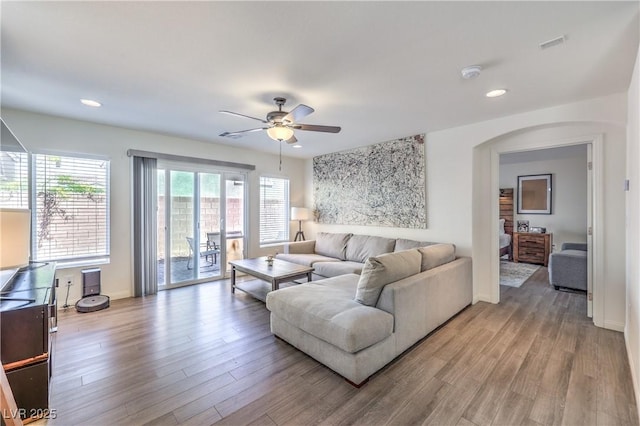 living room with recessed lighting, ceiling fan, and light wood-style floors