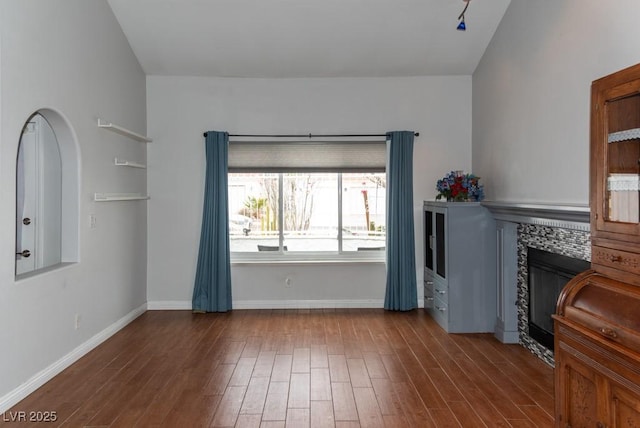 3008 Blue Fin Cir, Las Vegas, NV 89128 - living room featuring a tile fireplace, wood finished floors, and baseboards