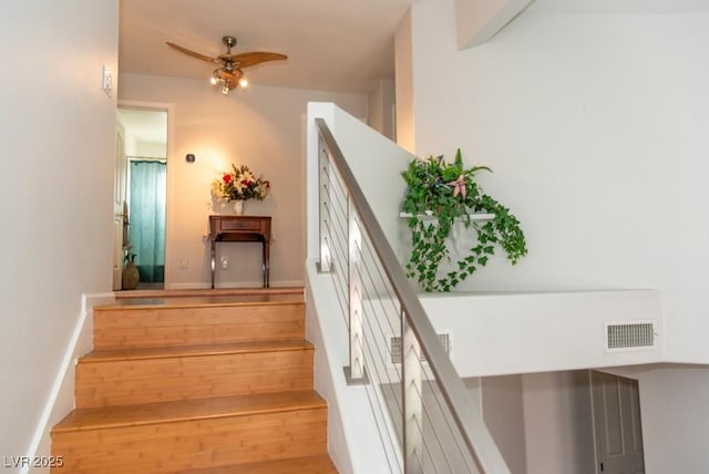 3008 Blue Fin Cir, Las Vegas, NV 89128 - staircase featuring a ceiling fan, baseboards, and wood finished floors