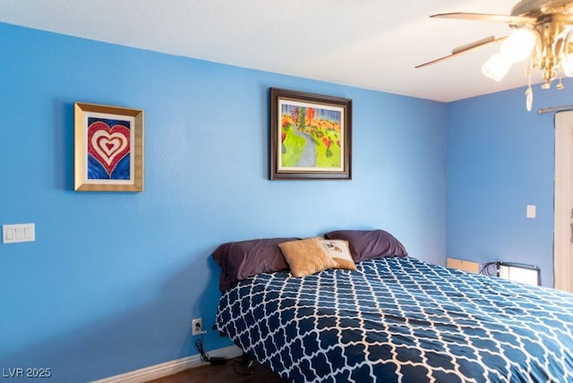 3008 Blue Fin Cir, Las Vegas, NV 89128 - bedroom with a ceiling fan, baseboards, and wood finished floors