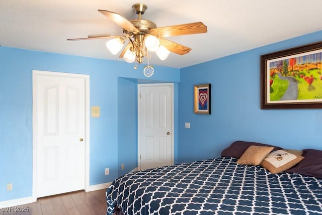 3008 Blue Fin Cir, Las Vegas, NV 89128 - bedroom featuring wood finished floors, baseboards, and a ceiling fan