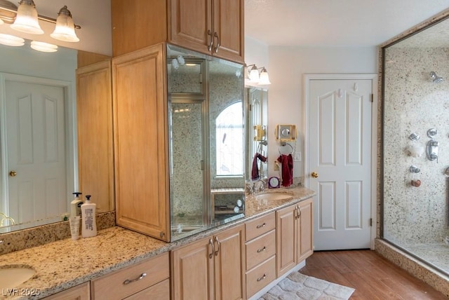 3008 Blue Fin Cir, Las Vegas, NV 89128 - full bathroom with wood finished floors, a stall shower, and double vanity