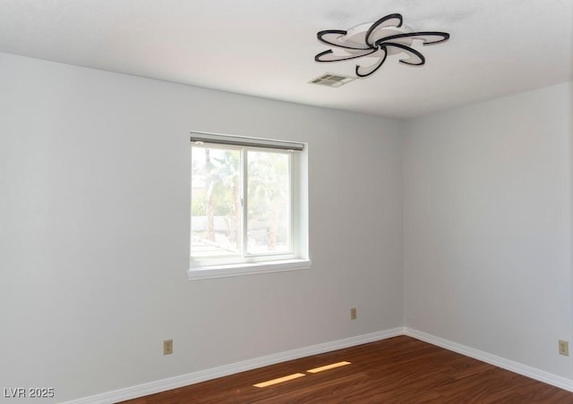 3008 Blue Fin Cir, Las Vegas, NV 89128 - unfurnished room with baseboards and wood finished floors