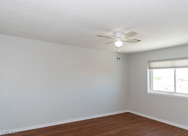 3008 Blue Fin Cir, Las Vegas, NV 89128 - spare room featuring ceiling fan, dark wood finished floors, and baseboards