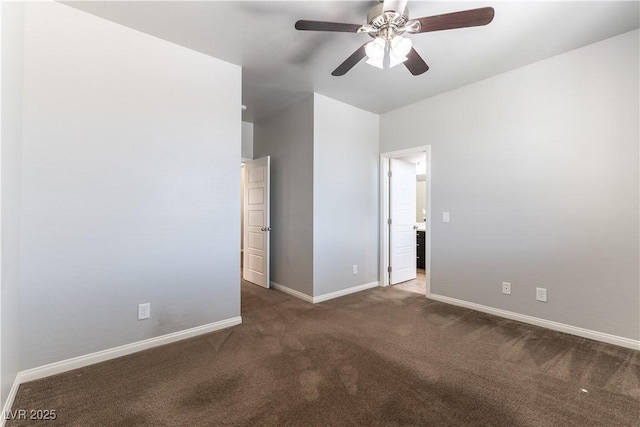 carpeted spare room with baseboards and ceiling fan