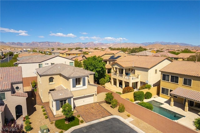 drone / aerial view featuring a mountain view and a residential view