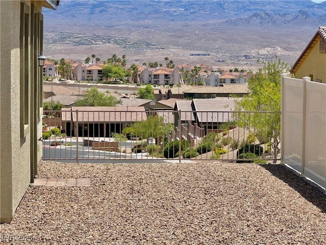 view of yard with a residential view and a mountain view