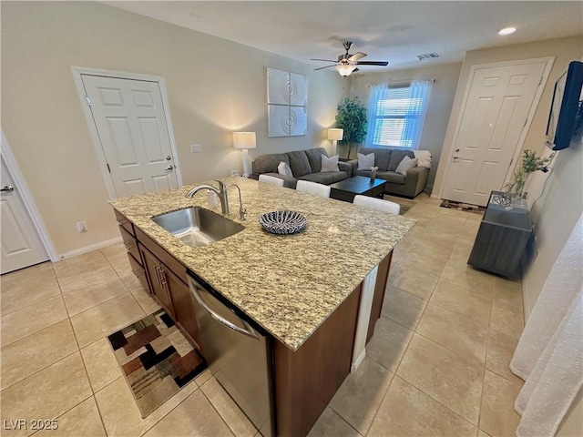 kitchen with stainless steel dishwasher, a ceiling fan, visible vents, a sink, and light tile patterned floors