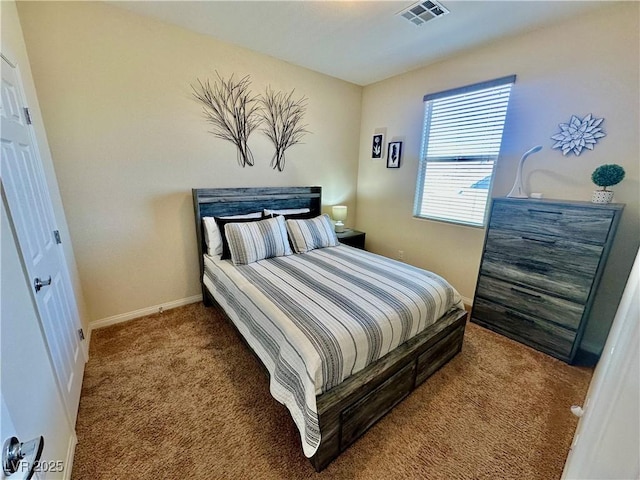 carpeted bedroom with baseboards and visible vents
