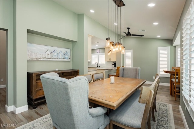 dining room with baseboards, a ceiling fan, recessed lighting, and wood finished floors