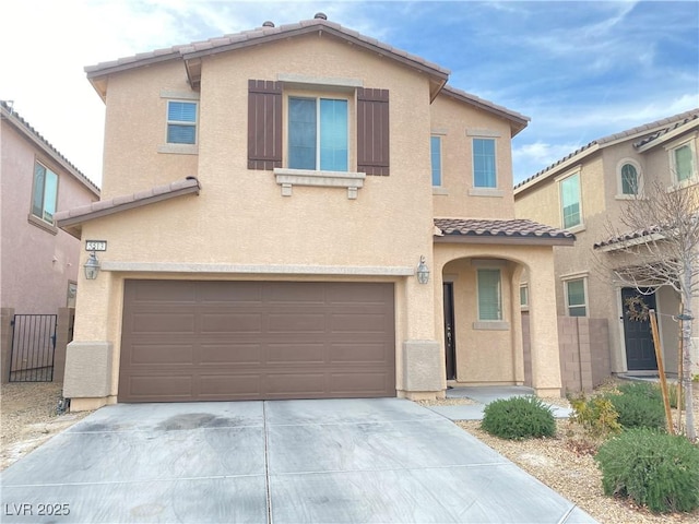 5513 Silent Springs Dr, Las Vegas, NV 89122 - traditional home with a tile roof, fence, concrete driveway, an attached garage, and stucco siding