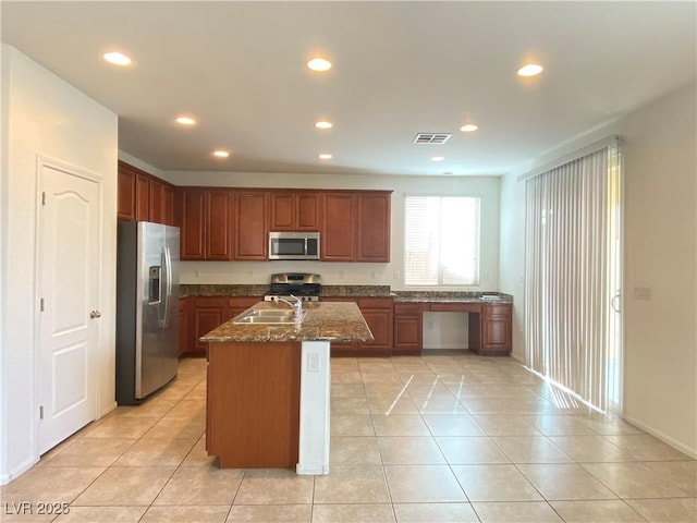 5513 Silent Springs Dr, Las Vegas, NV 89122 - kitchen with a sink, appliances with stainless steel finishes, recessed lighting, and visible vents