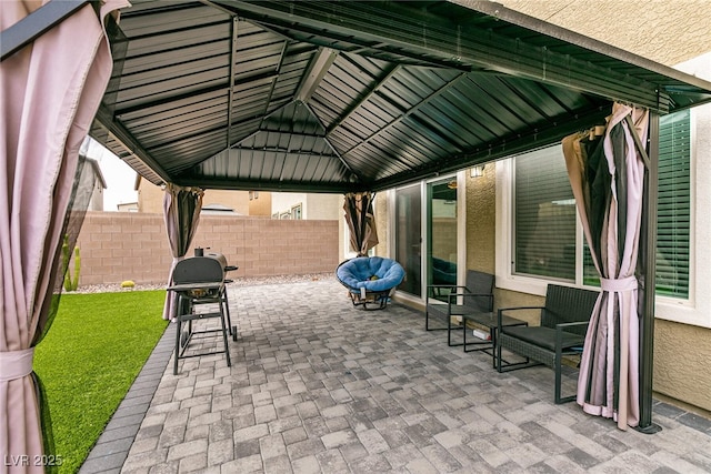 view of patio / terrace with a gazebo and fence