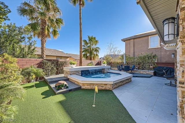 view of pool featuring a jacuzzi, a fenced backyard, and a patio area