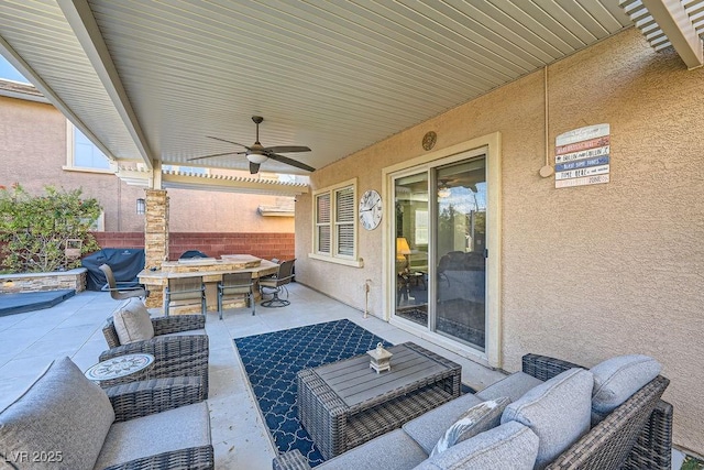 view of patio / terrace with outdoor dining area, a ceiling fan, fence, and an outdoor hangout area