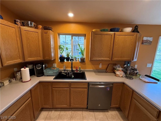 1409 Mill St, Ely, NV 89301 - kitchen with a sink, dishwasher, light countertops, recessed lighting, and light tile patterned floors
