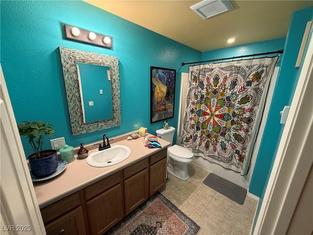 1409 Mill St, Ely, NV 89301 - bathroom with vanity, a textured wall, toilet, and shower / tub combo