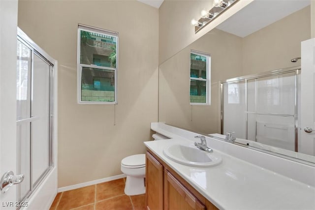 bathroom featuring a shower with shower door, tile patterned floors, baseboards, vanity, and toilet