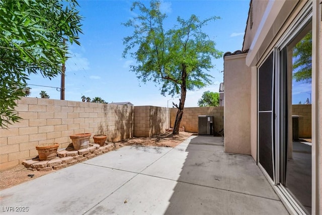 view of patio / terrace with central AC and a fenced backyard