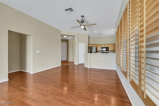 unfurnished living room featuring visible vents, wood finished floors, baseboards, recessed lighting, and a ceiling fan