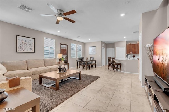 946 Belton Lake Ave, North Las Vegas, NV 89086 - living room with a ceiling fan, baseboards, recessed lighting, light tile patterned floors, and visible vents