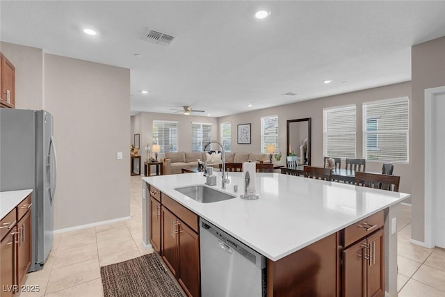 946 Belton Lake Ave, North Las Vegas, NV 89086 - kitchen featuring visible vents, open floor plan, a center island with sink, a sink, and stainless steel appliances