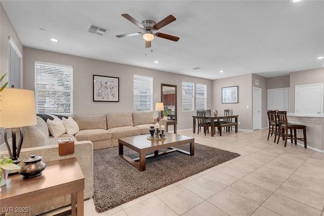 946 Belton Lake Ave, North Las Vegas, NV 89086 - living room with visible vents, baseboards, recessed lighting, a ceiling fan, and light tile patterned floors