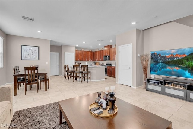 946 Belton Lake Ave, North Las Vegas, NV 89086 - living area with visible vents, recessed lighting, baseboards, and light tile patterned floors